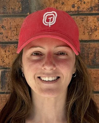 Ash Topham in a red Topham & Co cap